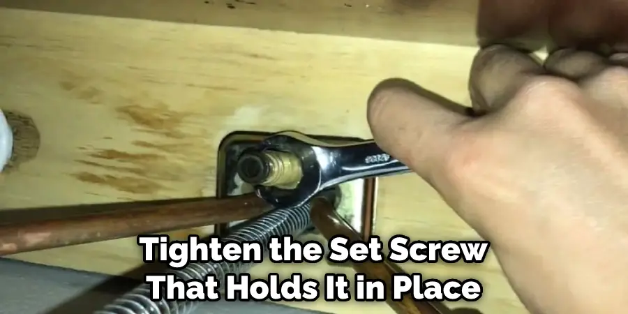 Tighten the Set Screw That Holds It in Place