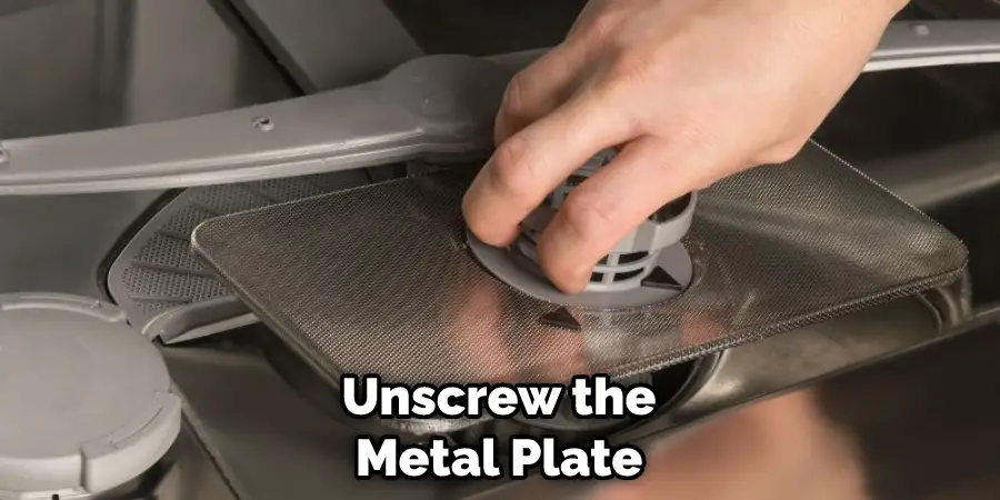 Unscrew the Metal Plate