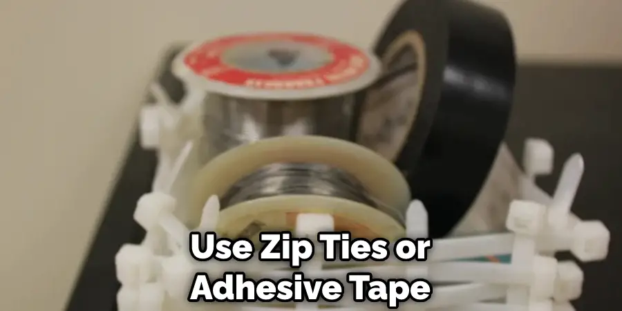 use zip ties or adhesive tape
