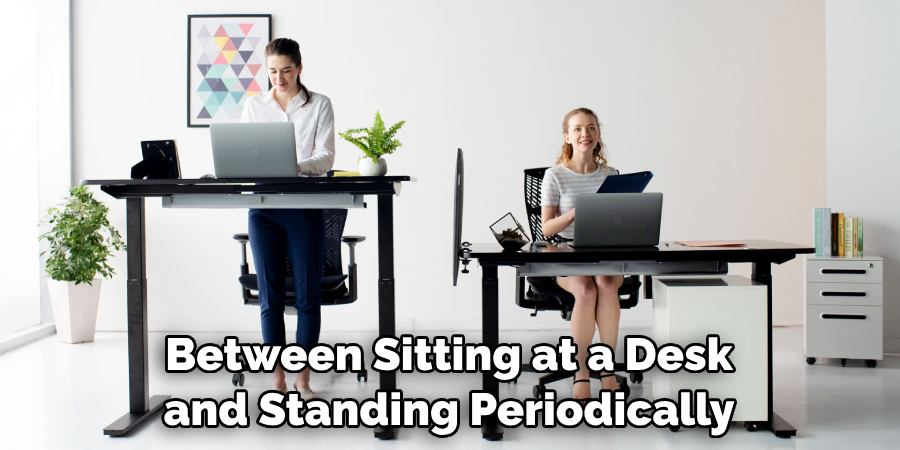 Between Sitting at a Desk and Standing Periodically