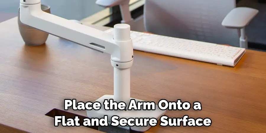 Place the Arm Onto a Flat and Secure Surface