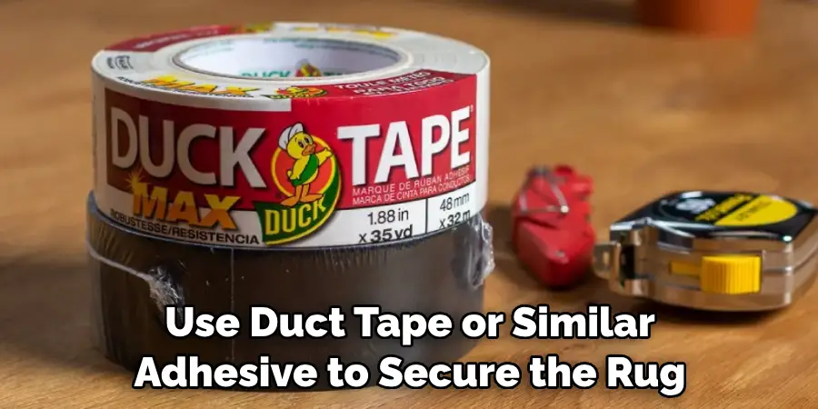 Use Duct Tape or Similar Adhesive to Secure the Rug