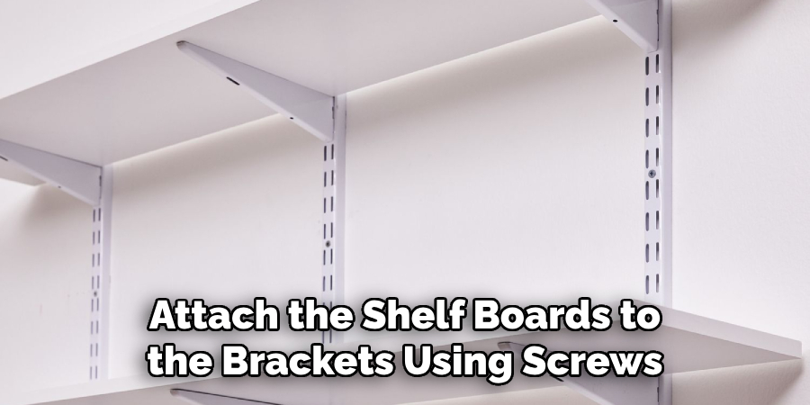 Attach the Shelf Boards to the Brackets Using Screws