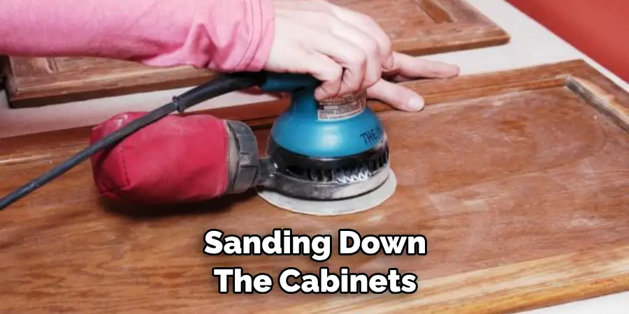 Sanding Down the Cabinets 
