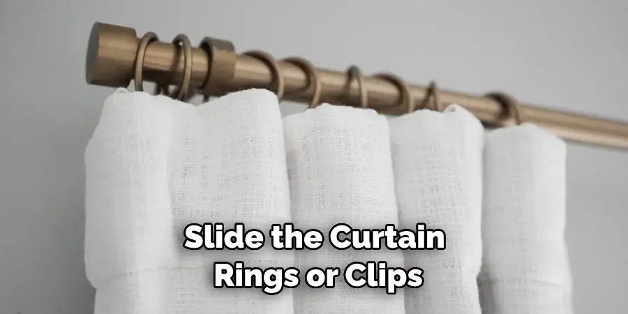 Slide the Curtain Rings or Clips