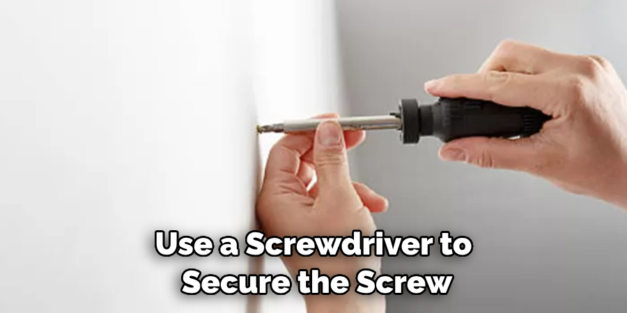 Use a Screwdriver to Secure the Screw