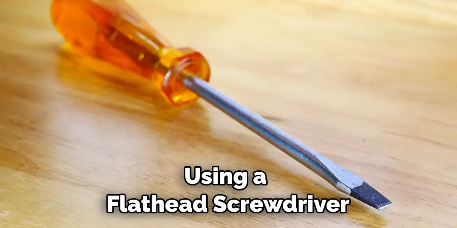 Using a Flathead Screwdriver