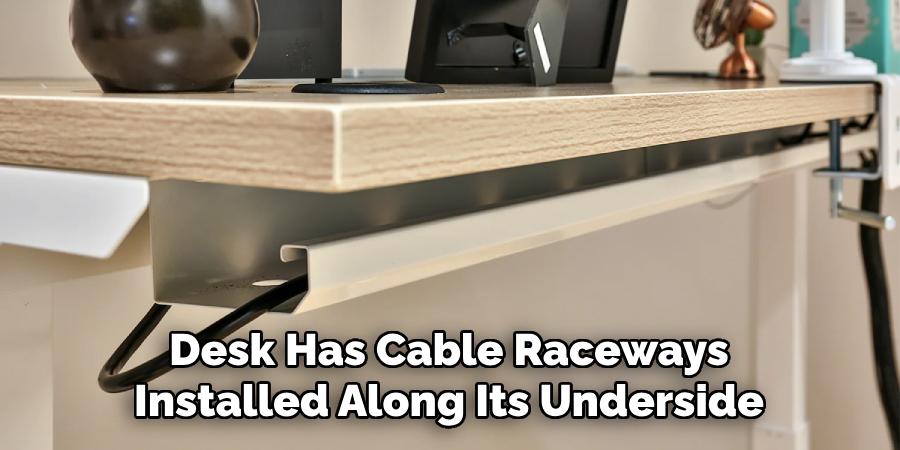 Desk Has Cable Raceways Installed Along Its Underside