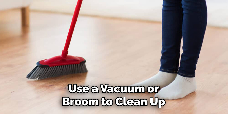 Use a Vacuum or Broom to Clean Up
