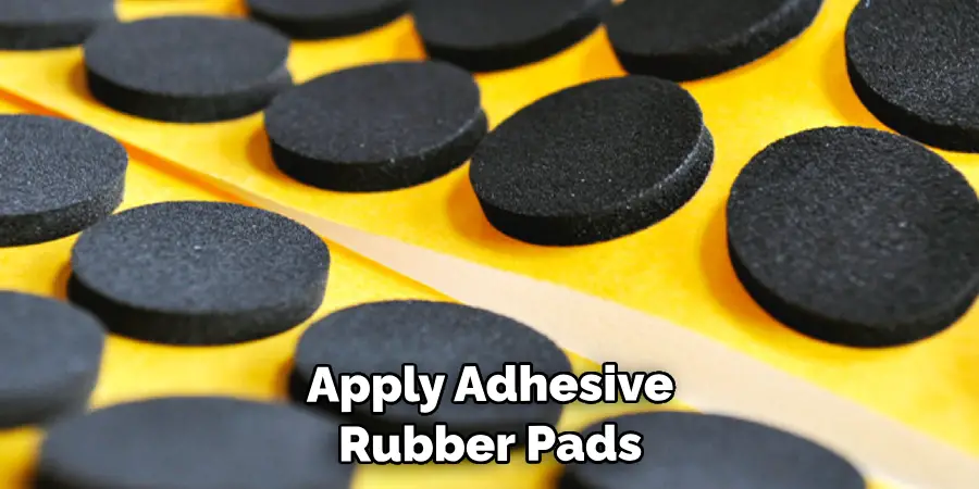 Apply Adhesive Rubber Pads 