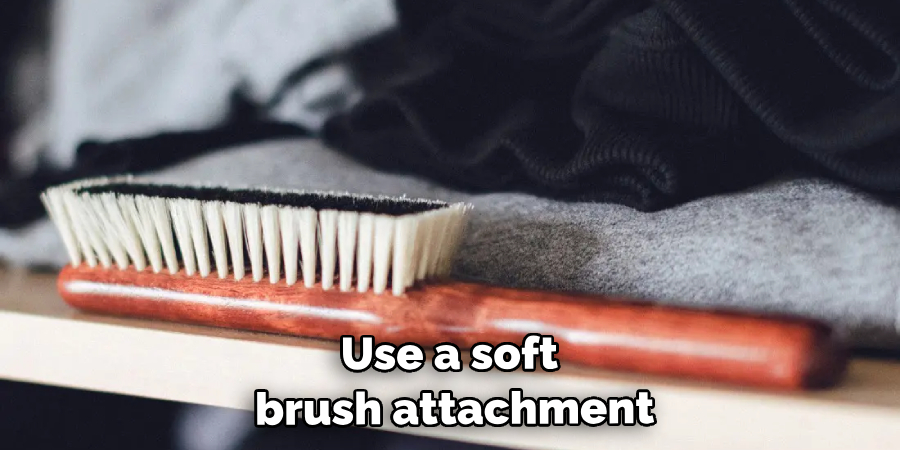 Use a soft brush attachment