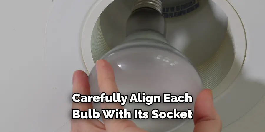 Carefully Align Each Bulb With Its Socket