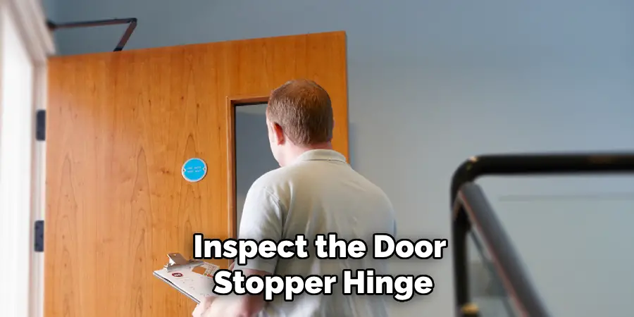 Inspect the Door Stopper Hinge