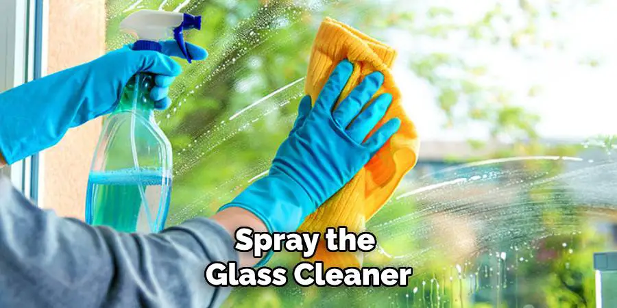 Spray the Glass Cleaner