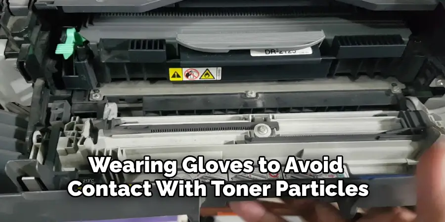 Wearing Gloves to Avoid 
Contact With Toner Particles