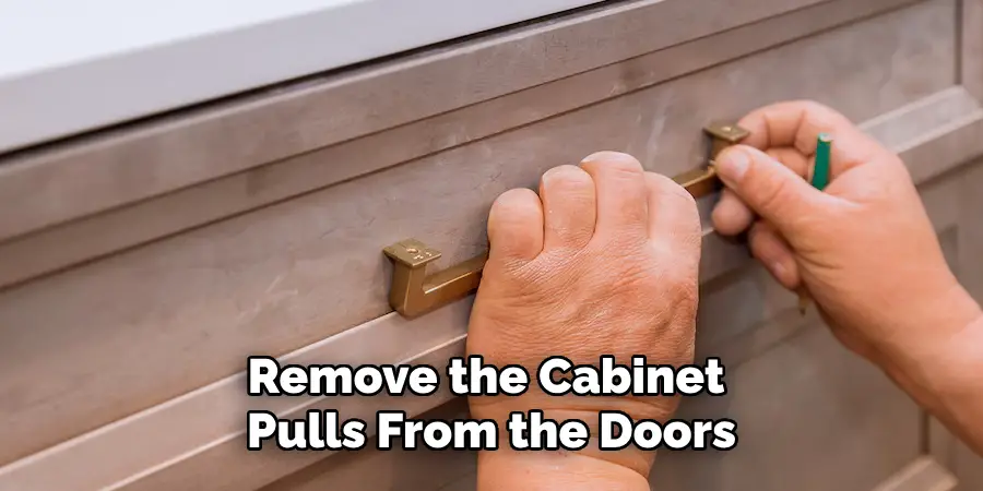 Remove the Cabinet Pulls From the Doors