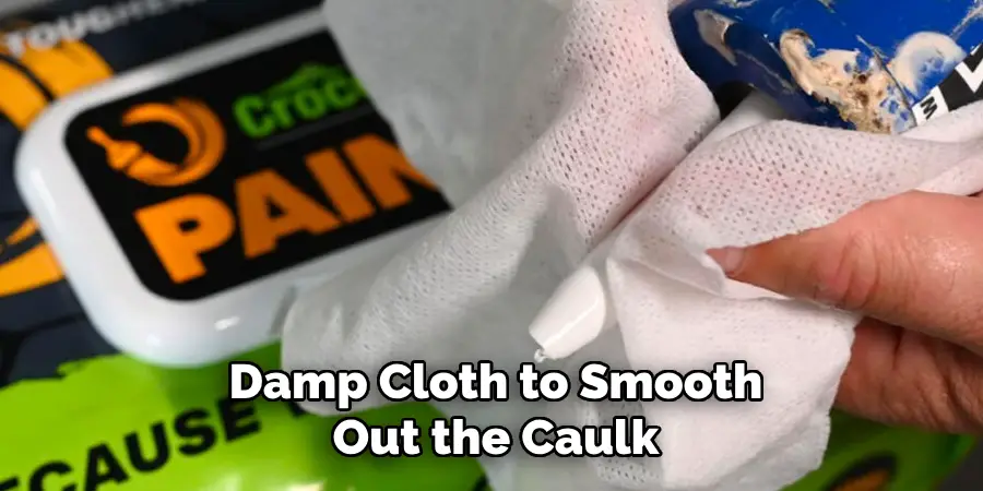 Damp Cloth to Smooth Out the Caulk