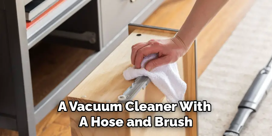A Vacuum Cleaner With 
A Hose and Brush