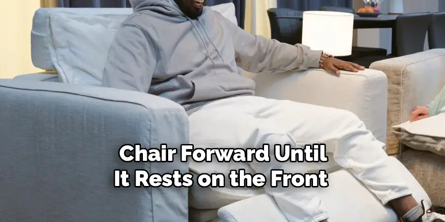  Chair Forward Until 
It Rests on the Front 