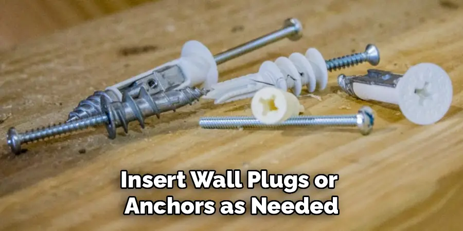 Insert Wall Plugs or
Anchors as Needed