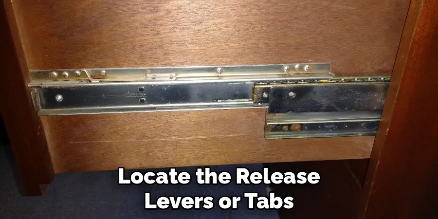 Locate the Release Levers or Tabs