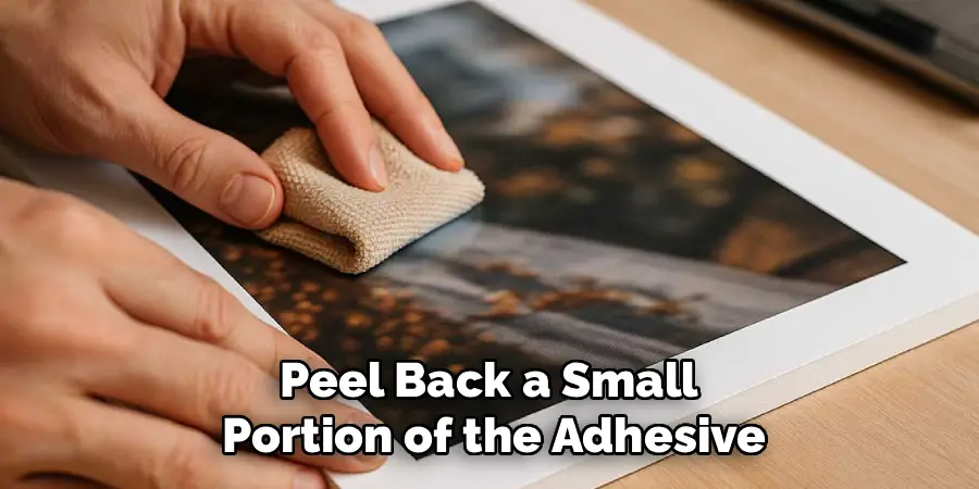 Peel Back a Small 
Portion of the Adhesive