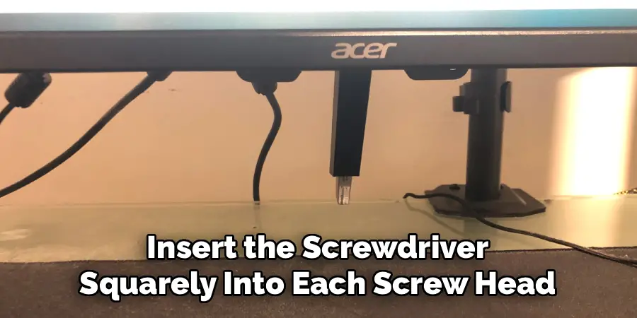 Insert the Screwdriver
Squarely Into Each Screw Head