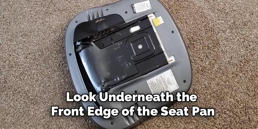 Look Underneath the
Front Edge of the Seat Pan