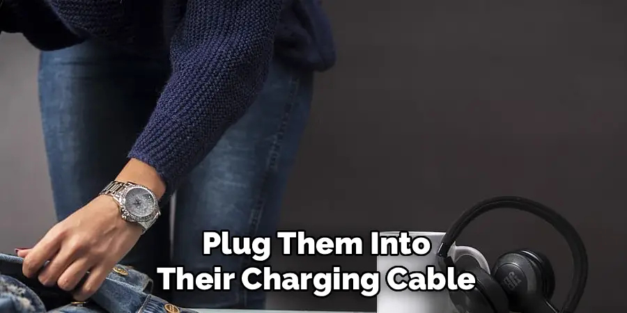 Plug Them Into Their Charging Cable