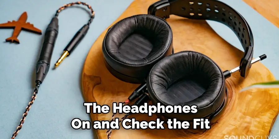 The Headphones On and Check the Fit